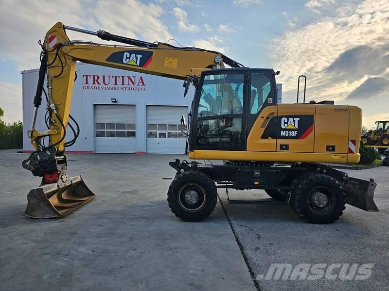 CAT M 318 F Excavatoare cu roti