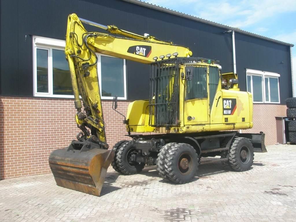 CAT M318F Excavatoare cu roti