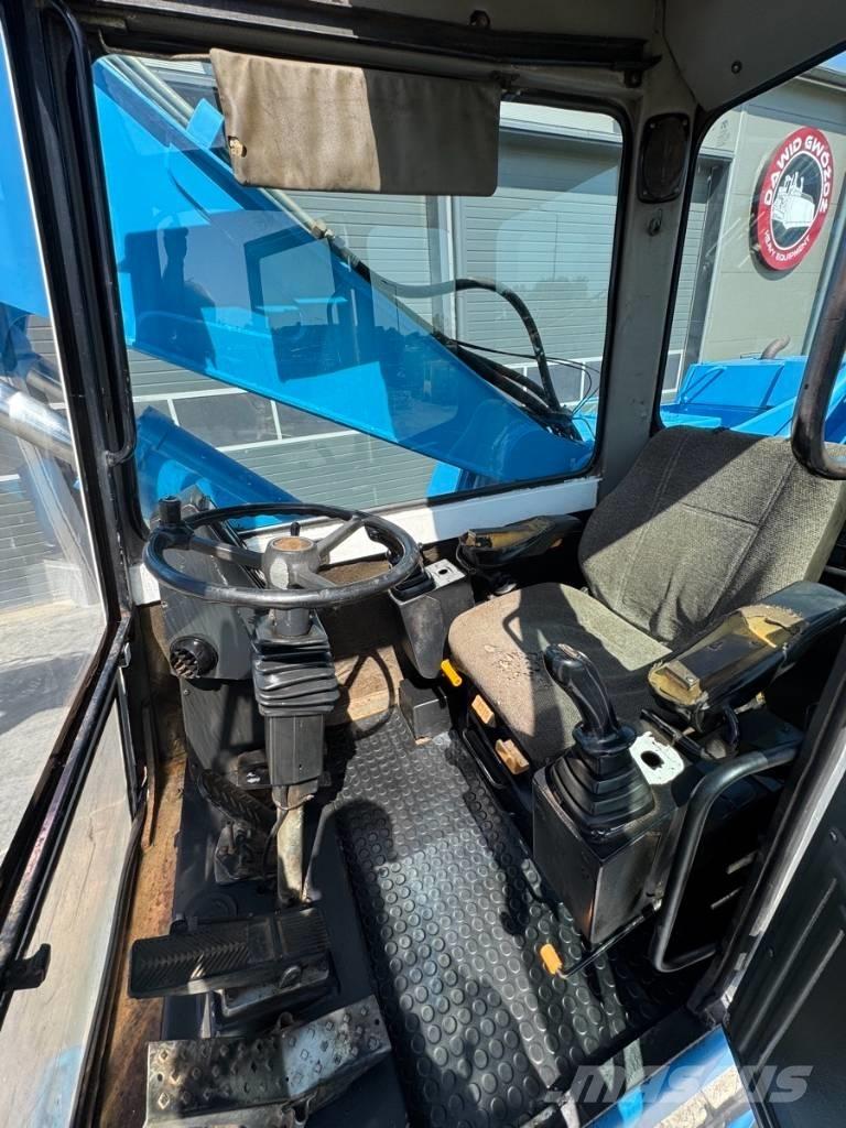 Fuchs MHL 331 Paleta de manipulare