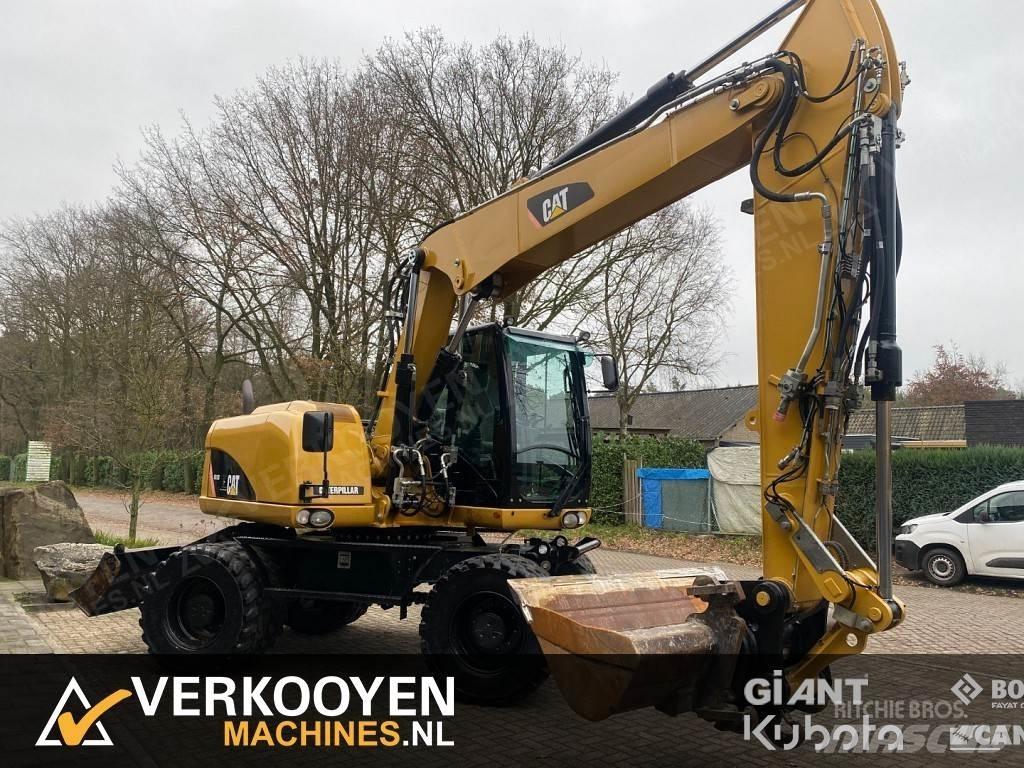 CAT M313D Excavatoare cu roti