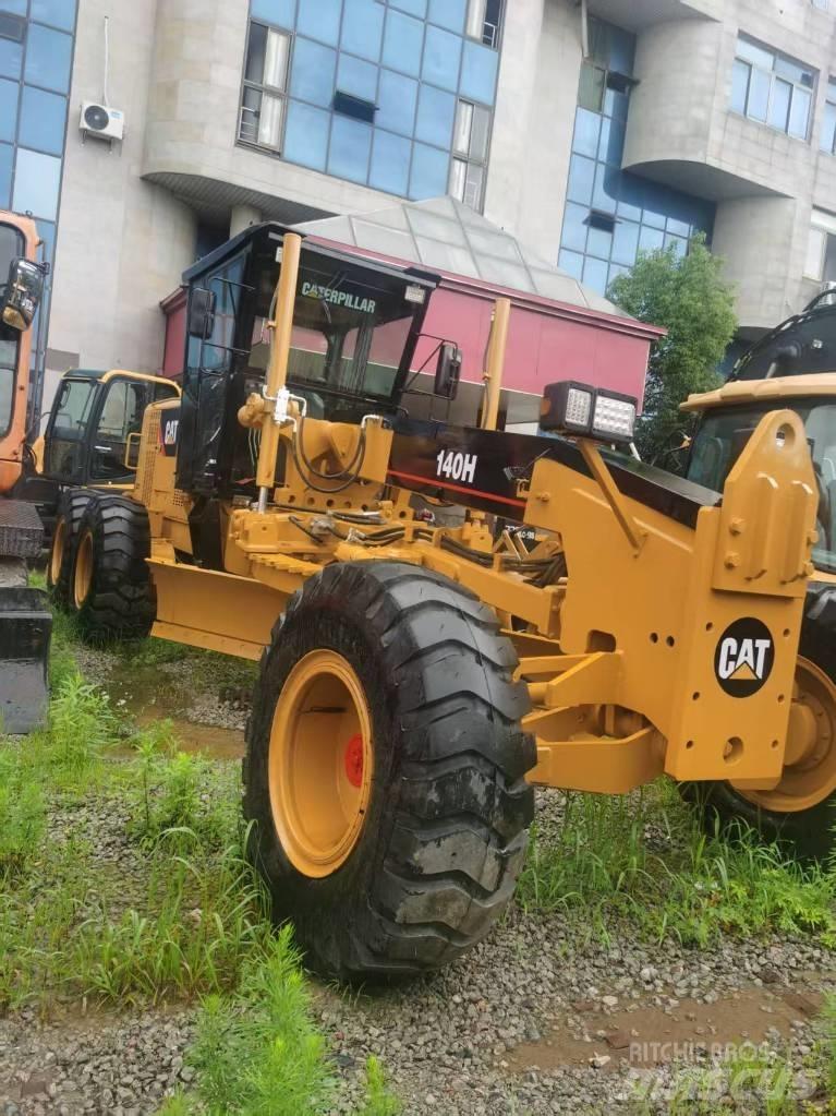 CAT 140 H Buldoexcavatoare