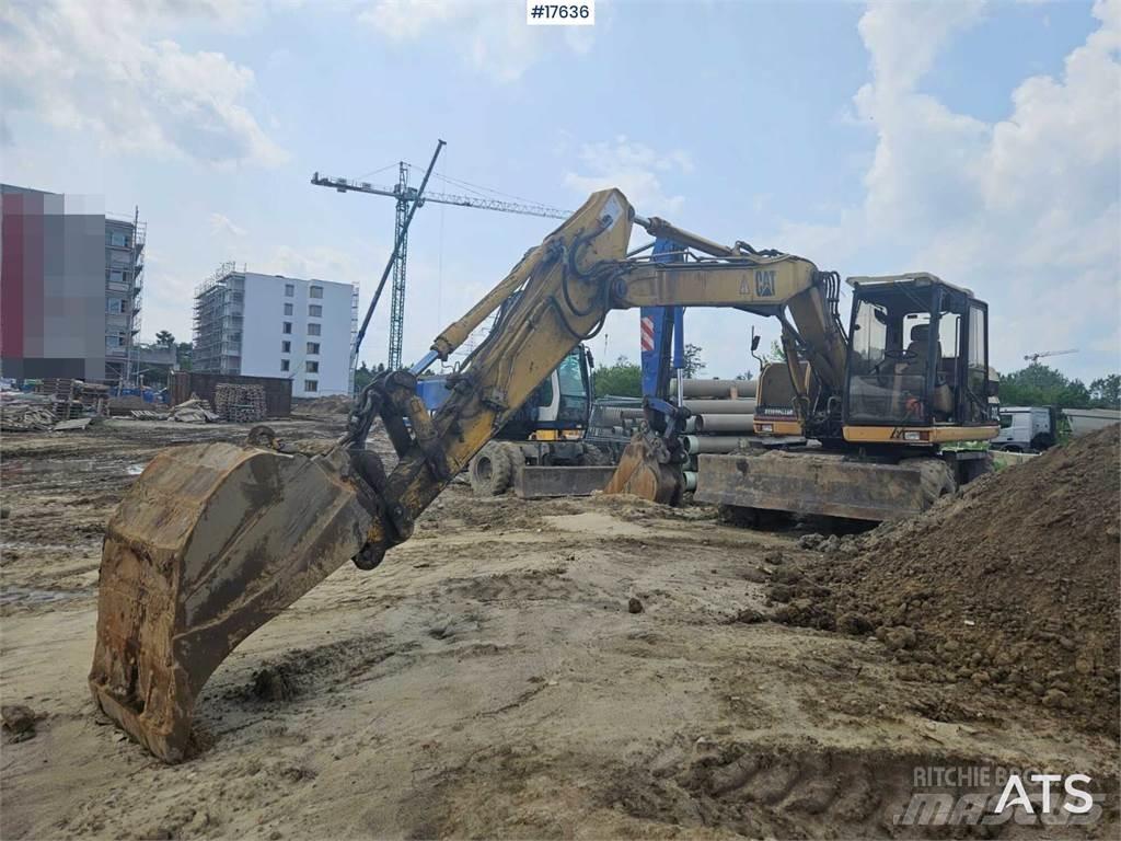 CAT M312 Excavatoare cu roti
