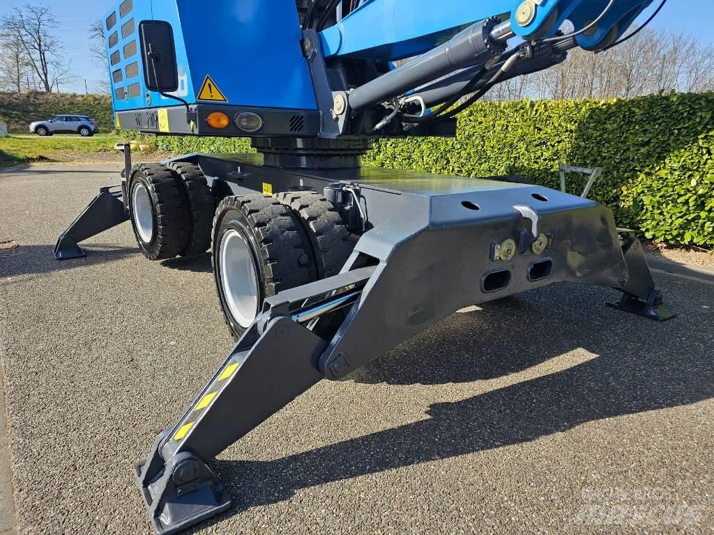 Fuchs MHL 320 Paleta de manipulare