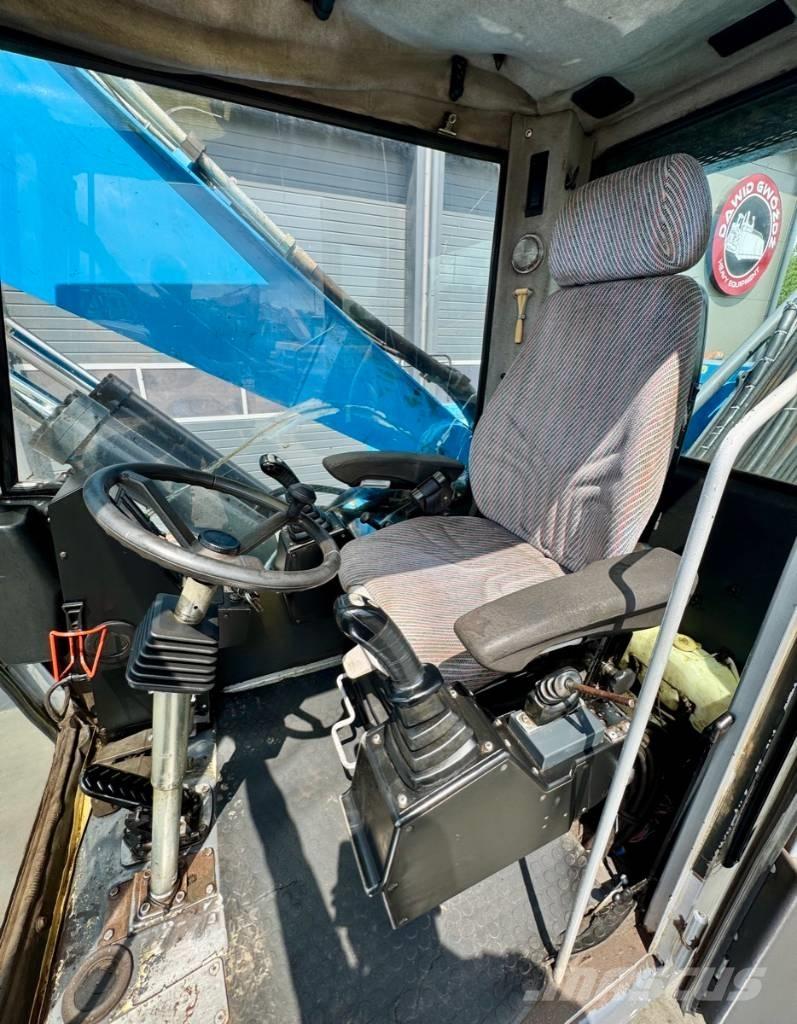 Fuchs MHL 331 Paleta de manipulare