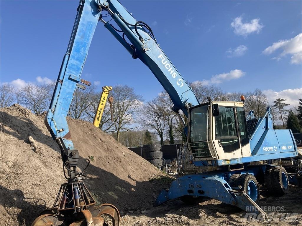 Fuchs MHL 331 Paleta de manipulare
