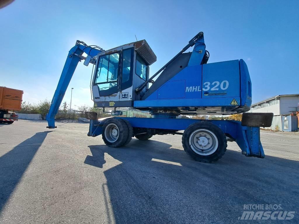 Fuchs MHL 320D Paleta de manipulare