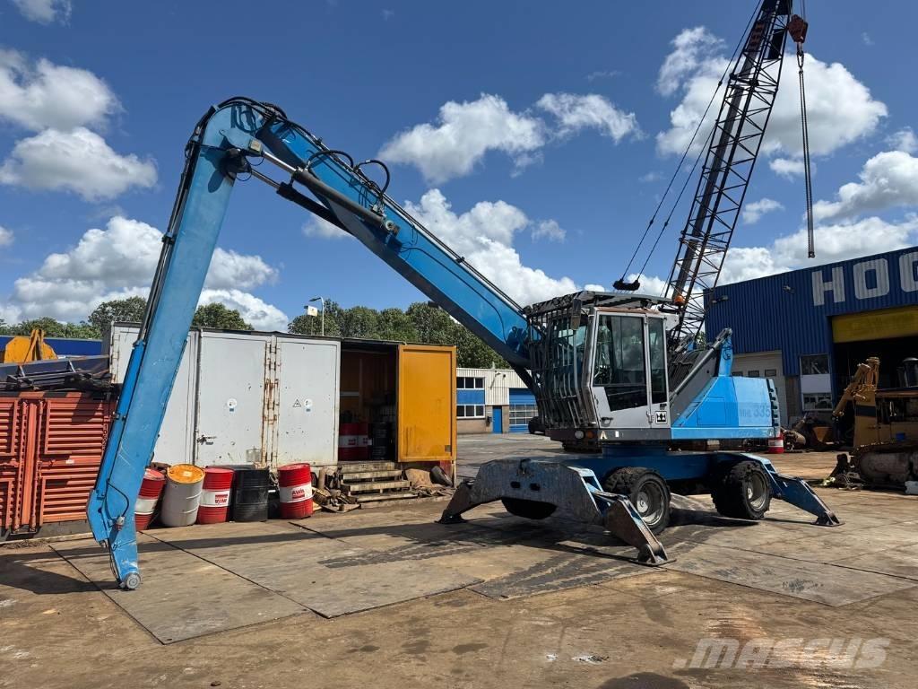 Fuchs MHL 335 Paleta de manipulare