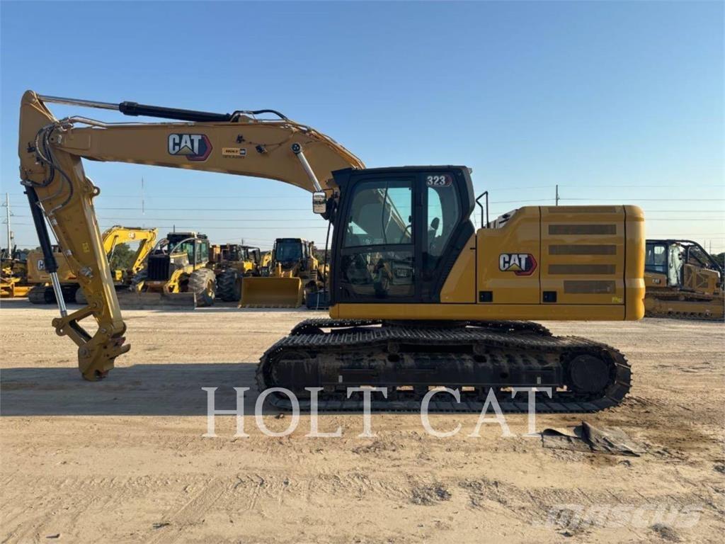 CAT 323 TC Incarcator pe pneuri