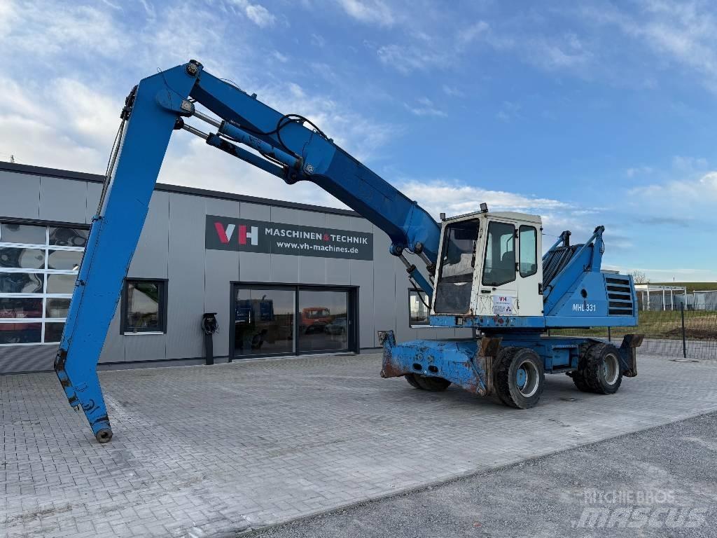 Fuchs MHL 331 Paleta de manipulare