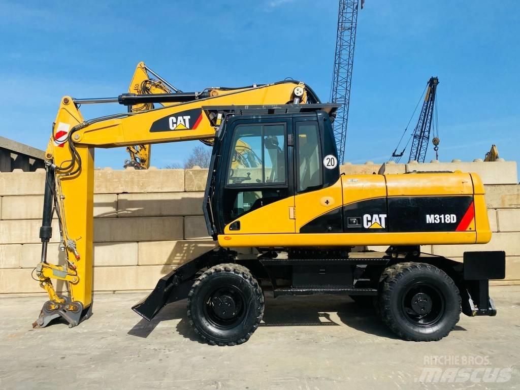 CAT M 318 D Excavatoare cu roti
