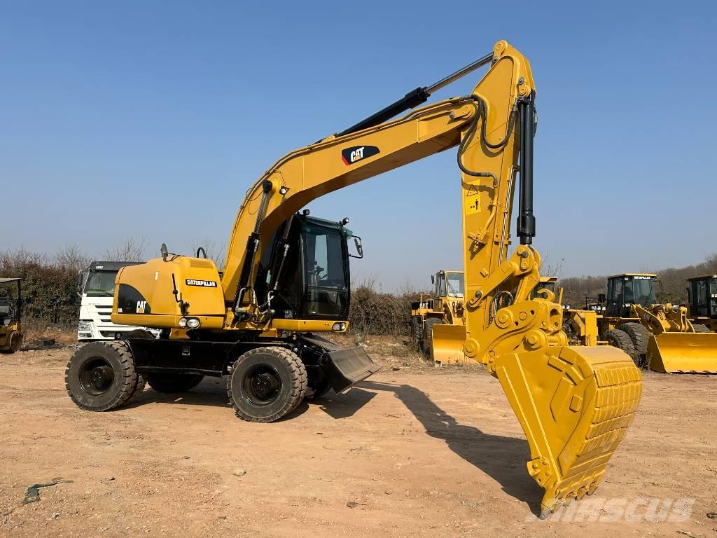 CAT M 320D Excavatoare cu roti