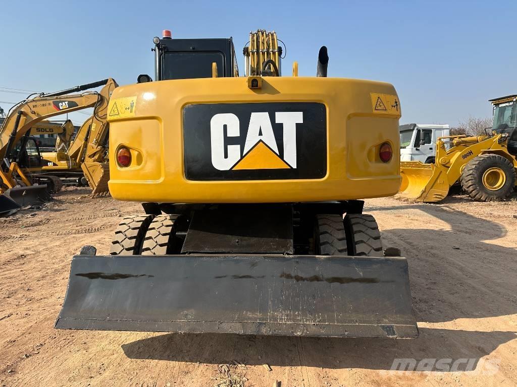CAT M 320D Excavatoare cu roti