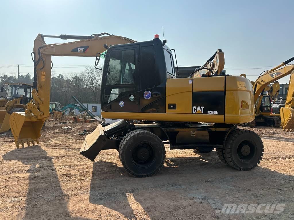 CAT M 320D Excavatoare cu roti