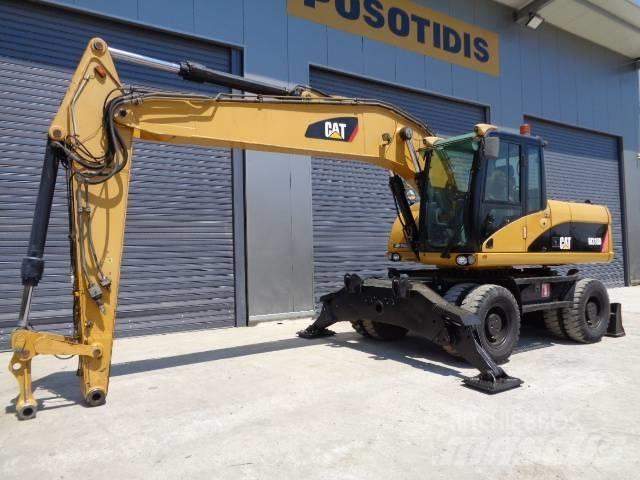 CAT M 318 D Excavatoare cu roti