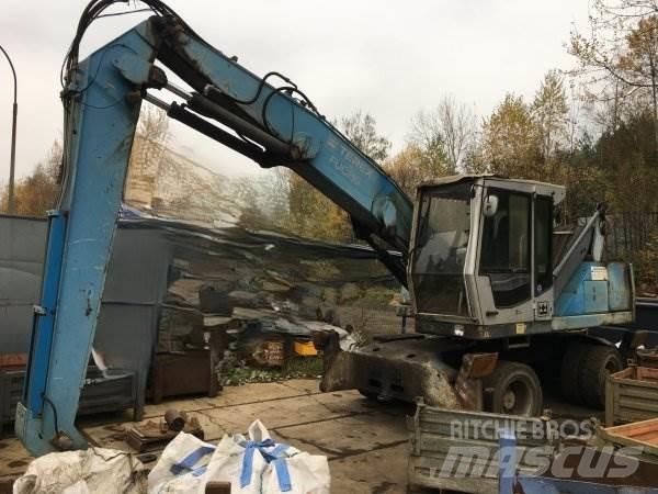 Fuchs MHL 320 Paleta de manipulare