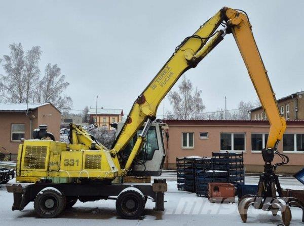 Fuchs MHL 331 Paleta de manipulare