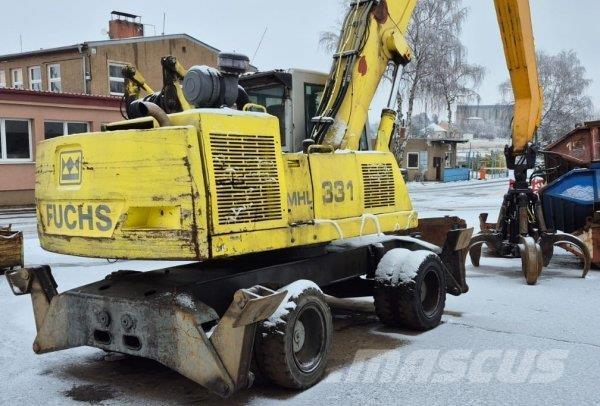 Fuchs MHL 331 Paleta de manipulare