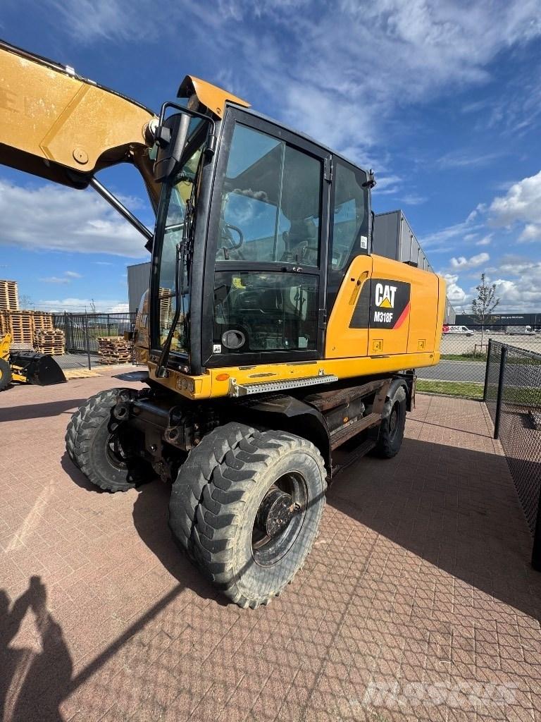 CAT 318 Excavatoare cu roti