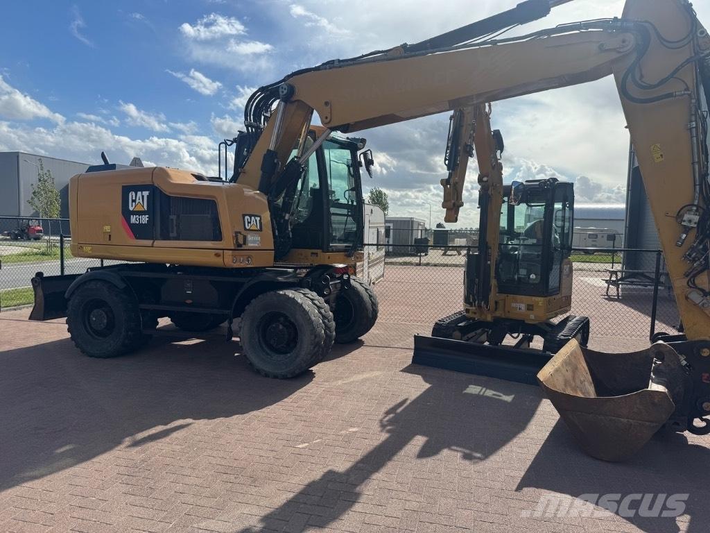 CAT 318 Excavatoare cu roti