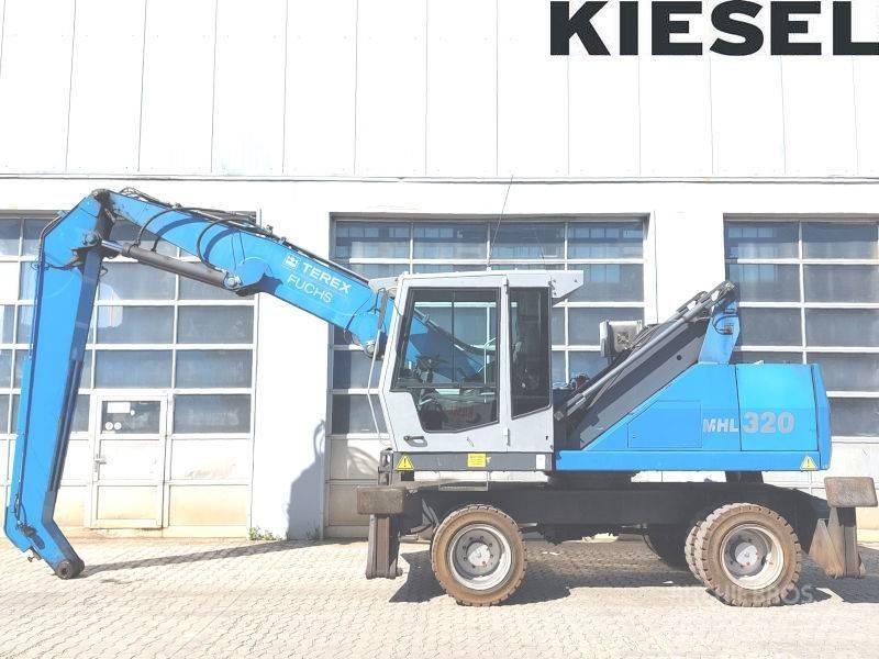 Fuchs MHL 320 D Paleta de manipulare