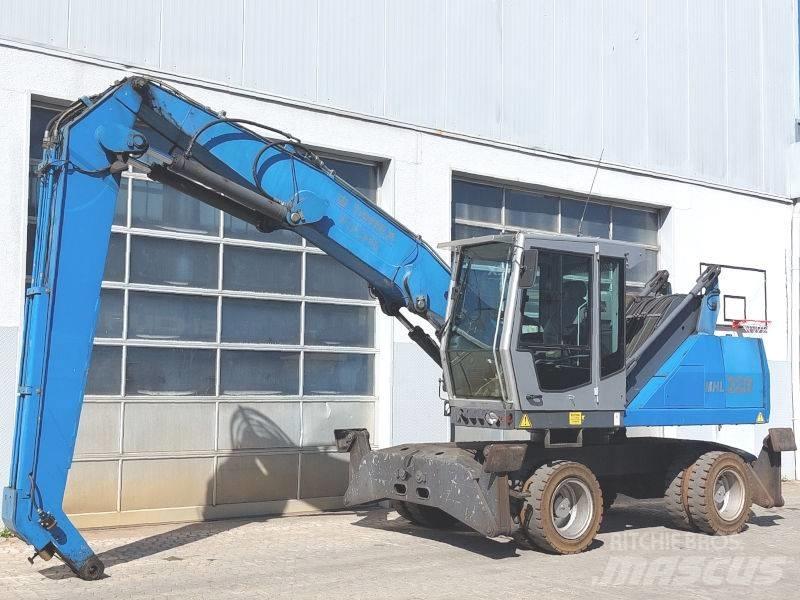 Fuchs MHL 320 D Paleta de manipulare