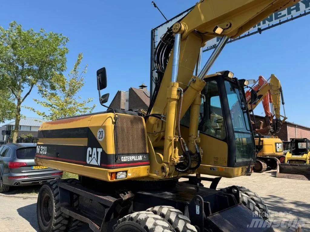 CAT M320 2001 Excavatoare cu roti