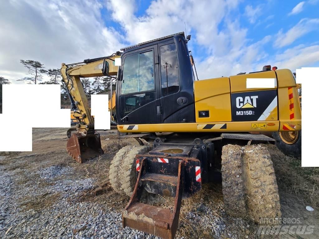 CAT M 315 D Excavatoare cu roti