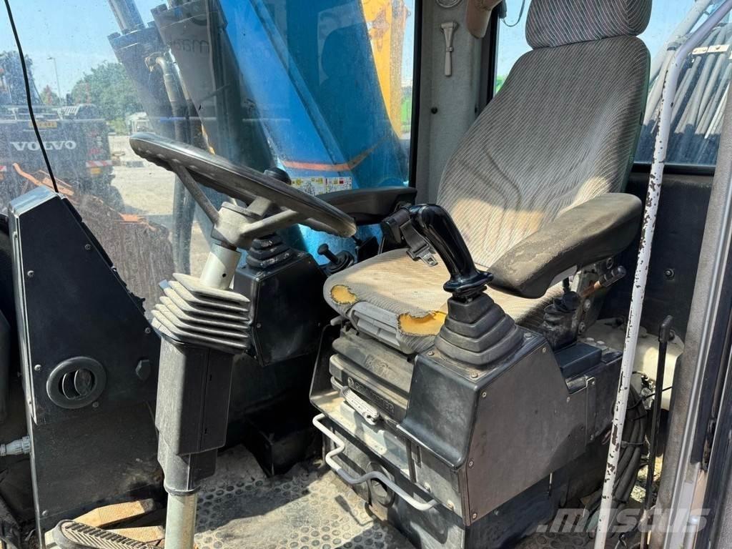 Fuchs MHL 320 Paleta de manipulare