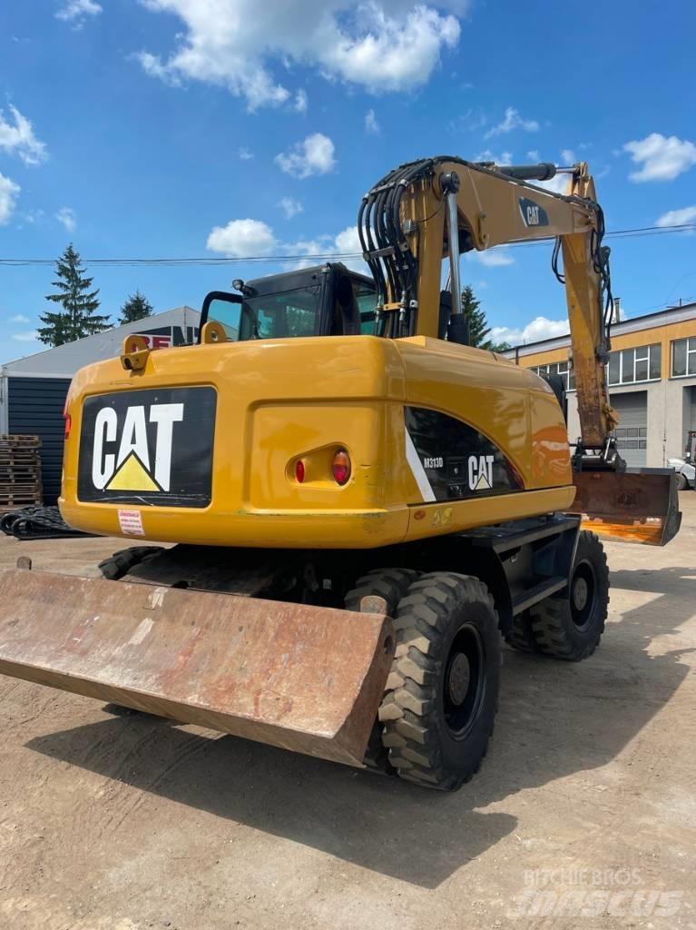 CAT M 313 D Excavatoare cu roti
