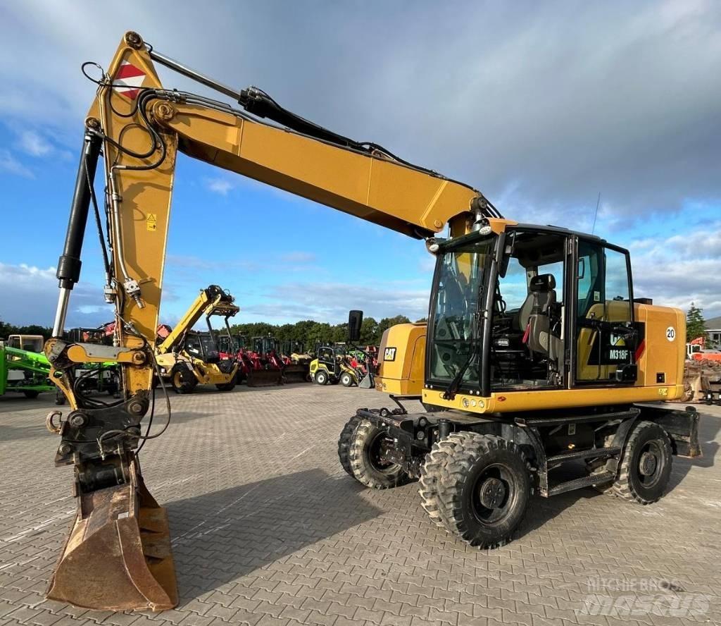 CAT M 318 F Excavatoare cu roti