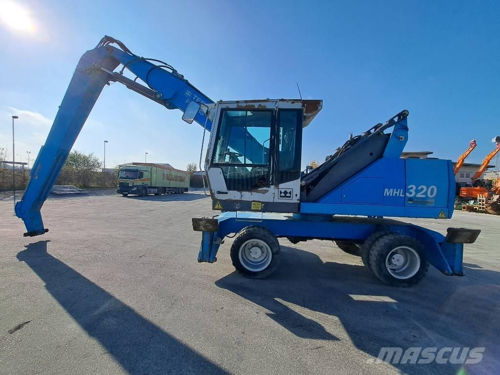 Fuchs MHL 320 D Paleta de manipulare