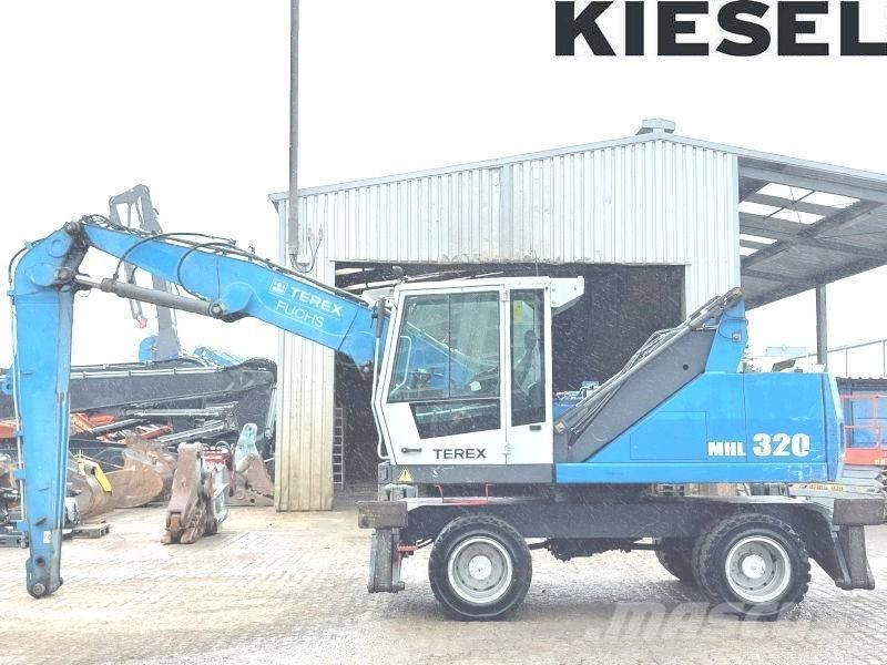 Fuchs MHL 320 D Paleta de manipulare