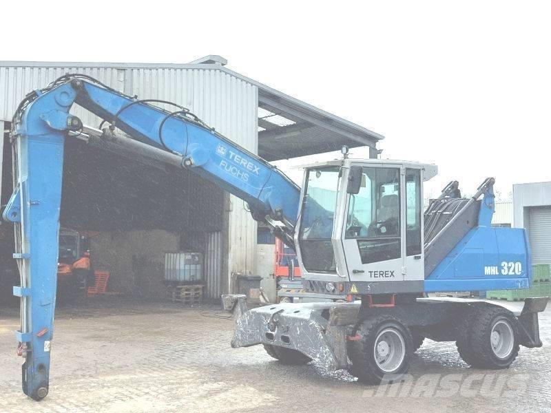 Fuchs MHL 320 D Paleta de manipulare