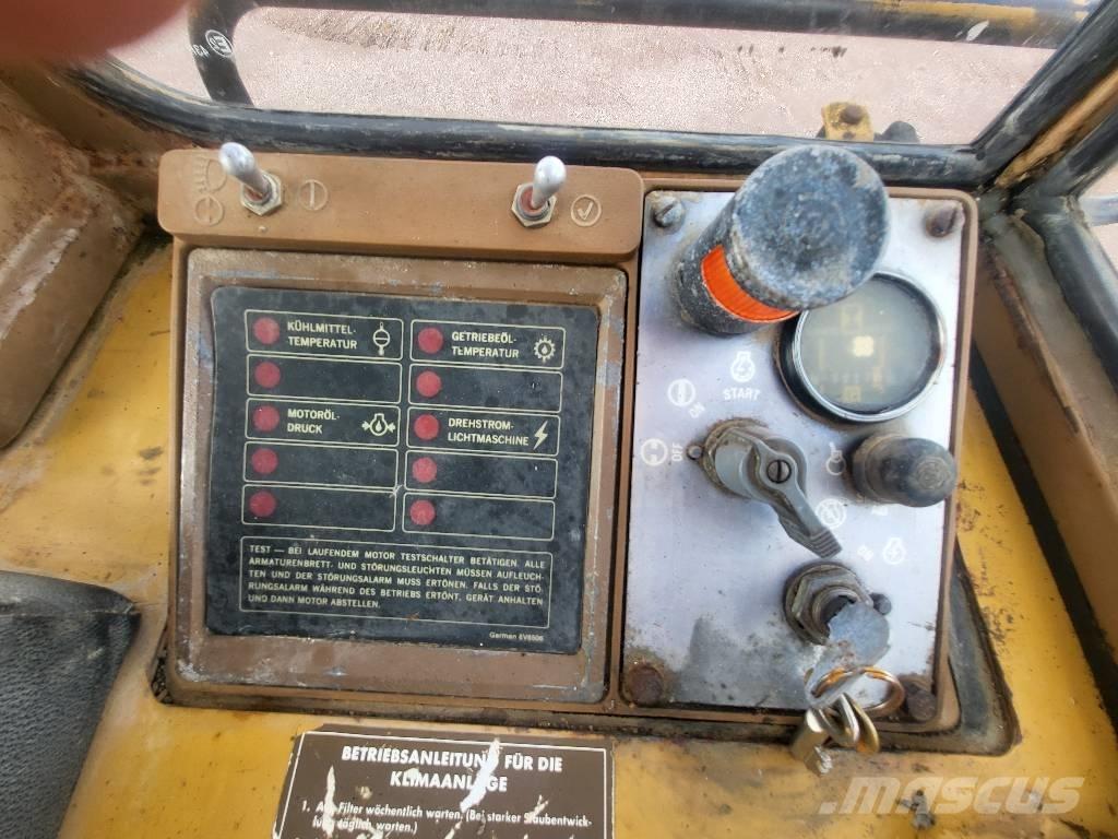 CAT 943 Încarcatoare cu excavator