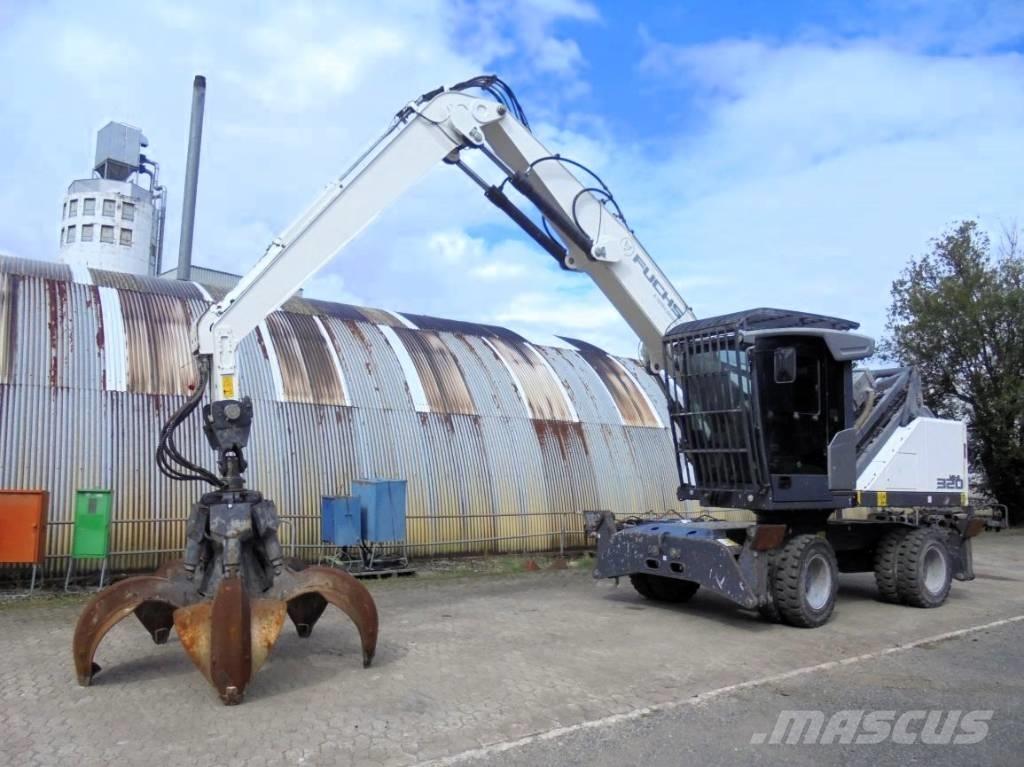 Fuchs MHL 320 Paleta de manipulare