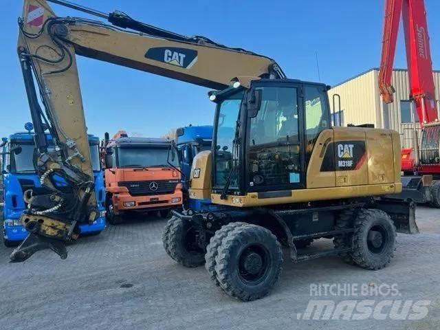 CAT M 318 F Excavatoare cu roti