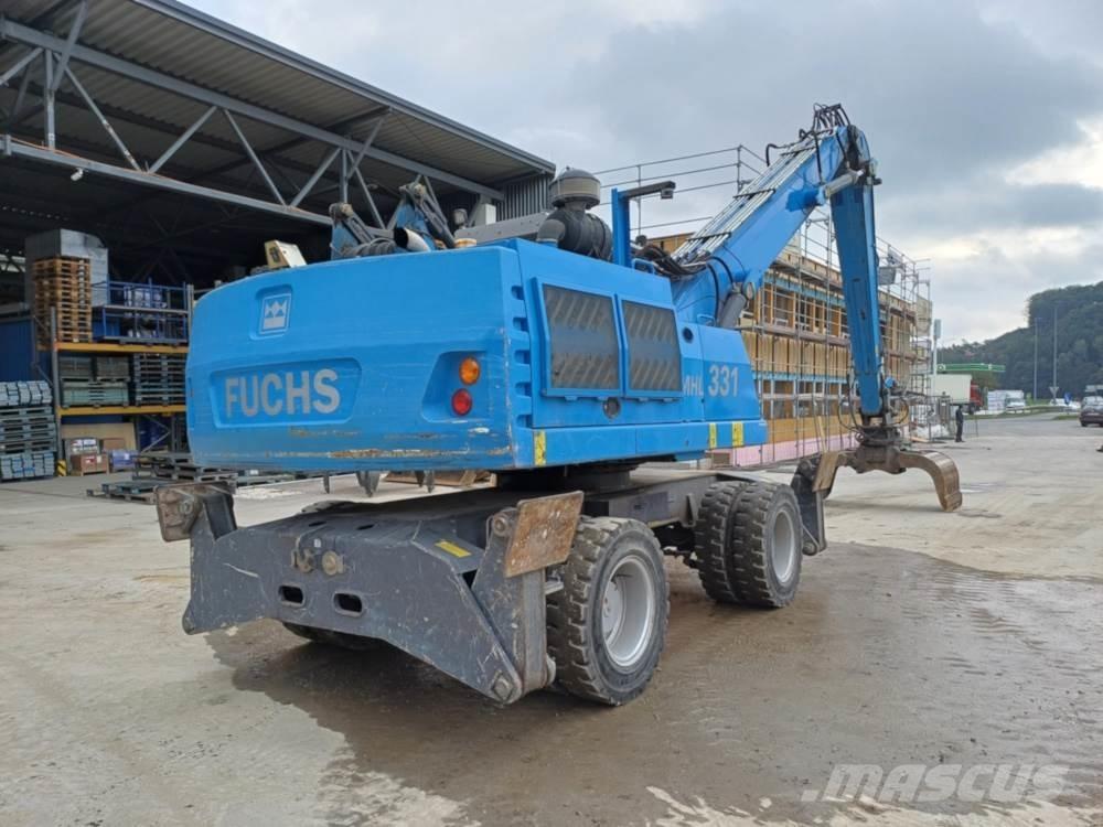 Fuchs MHL 331 Paleta de manipulare