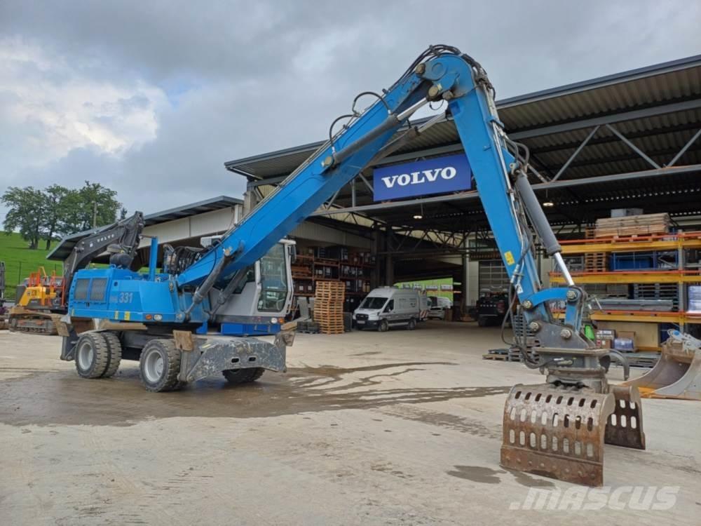 Fuchs MHL 331 Paleta de manipulare