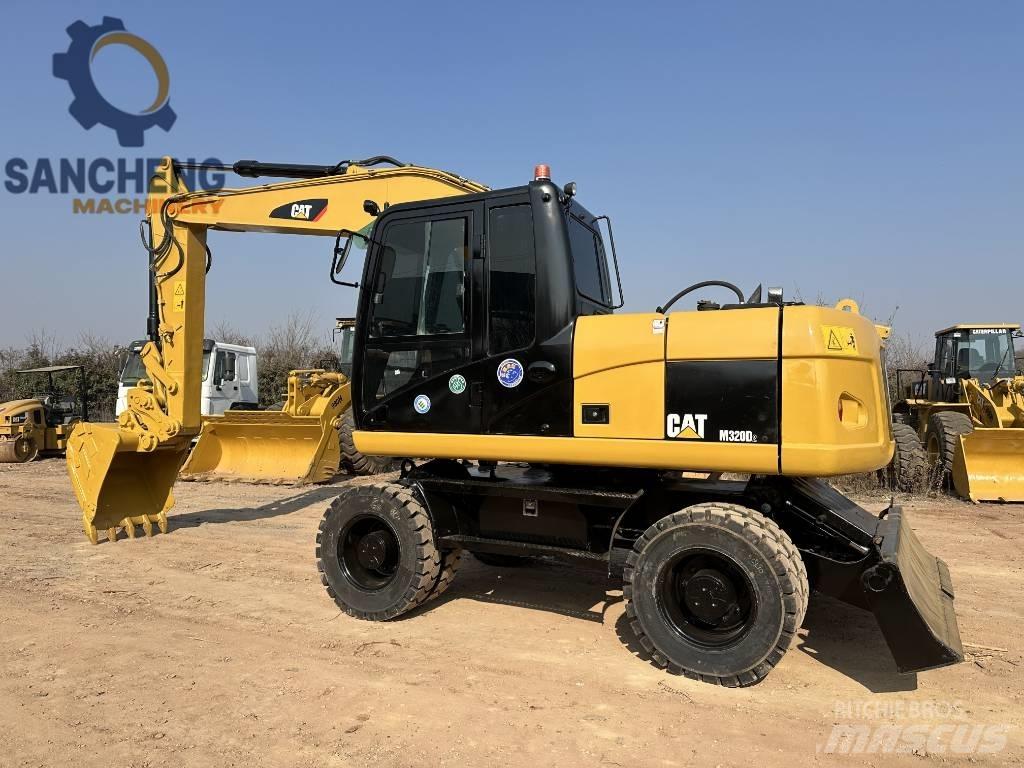 CAT M 320 D Excavatoare cu roti