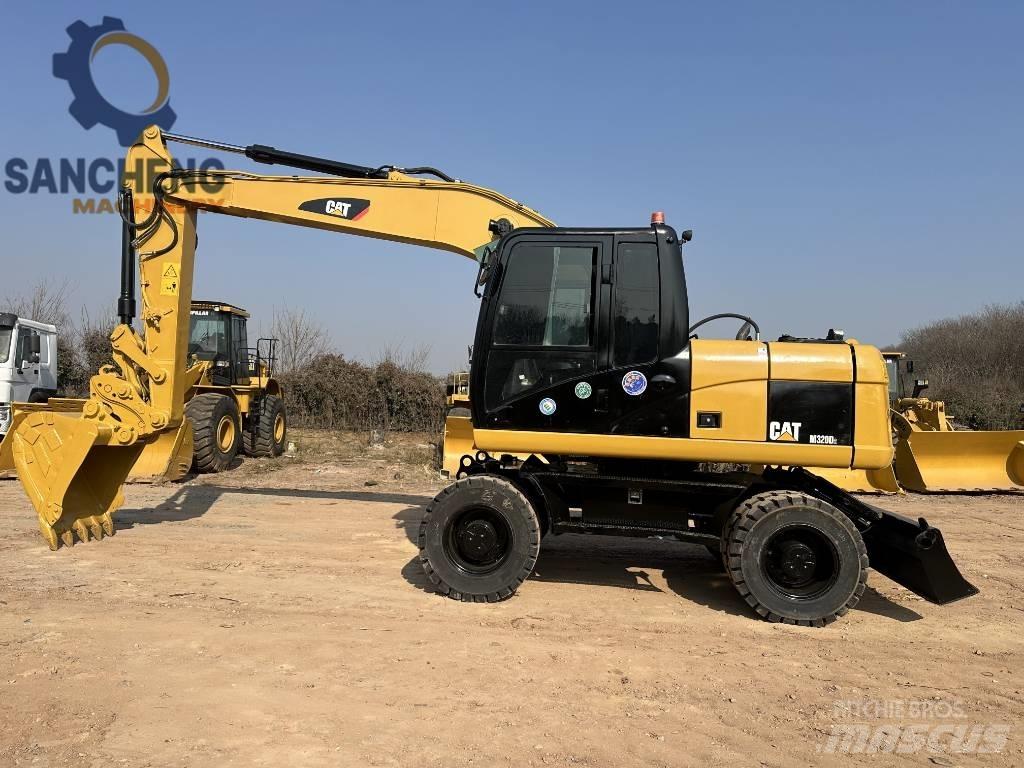 CAT M 320 D Excavatoare cu roti