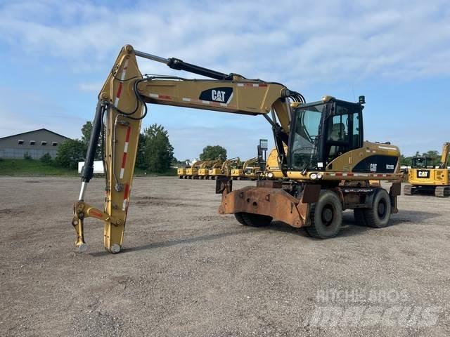 CAT M318D Excavatoare cu roti