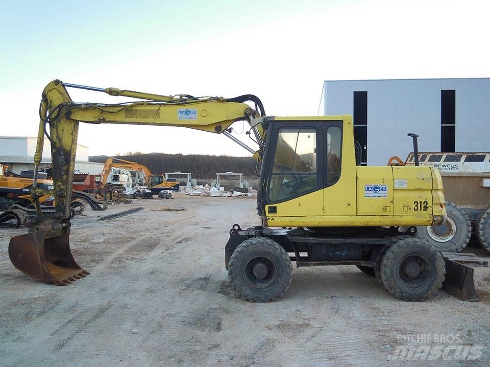 CAT M312 Excavatoare cu roti