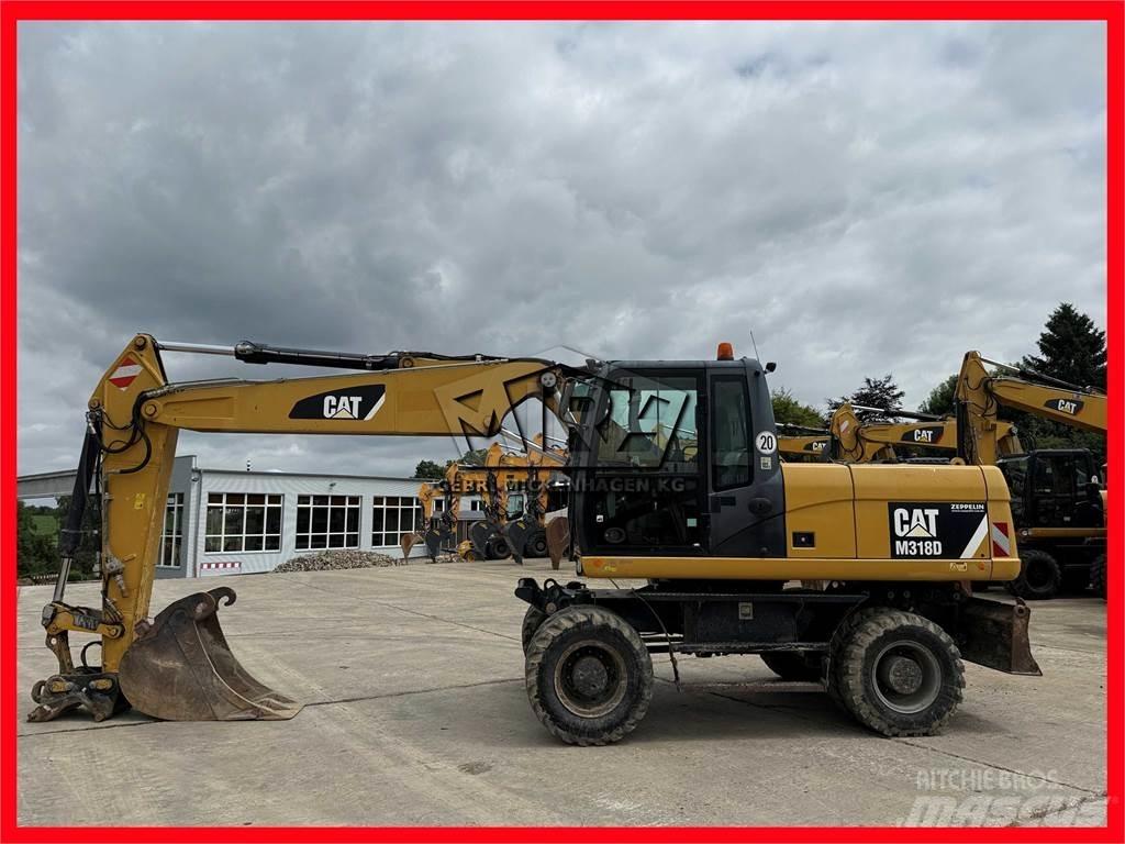 CAT M 318 D Excavatoare cu roti