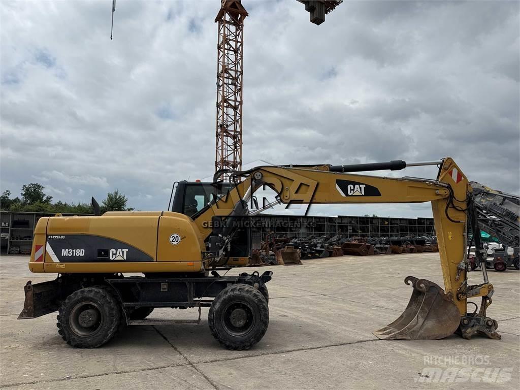 CAT M 318 D Excavatoare cu roti