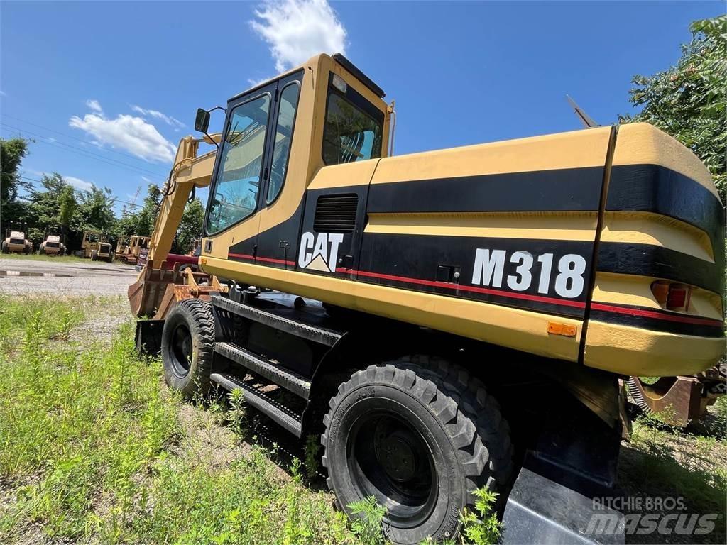 CAT M318 Excavatoare cu roti