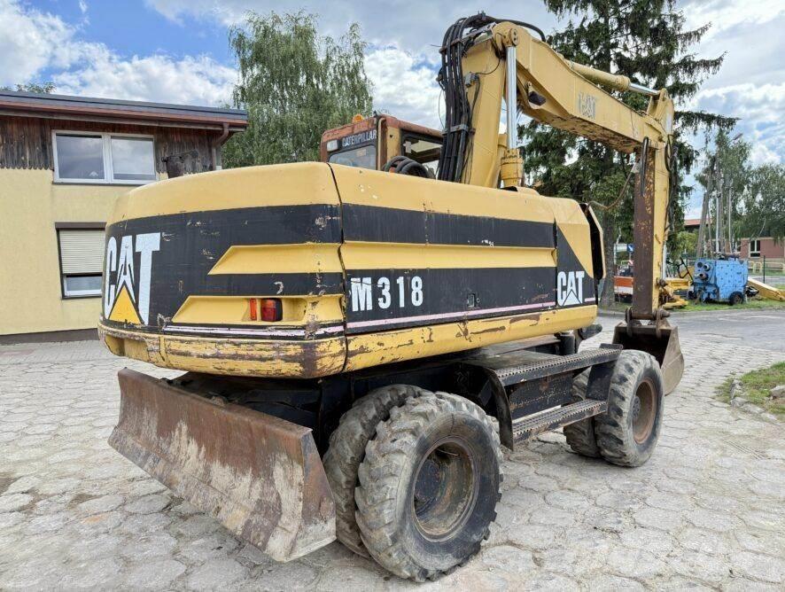 CAT M318 Excavatoare cu roti