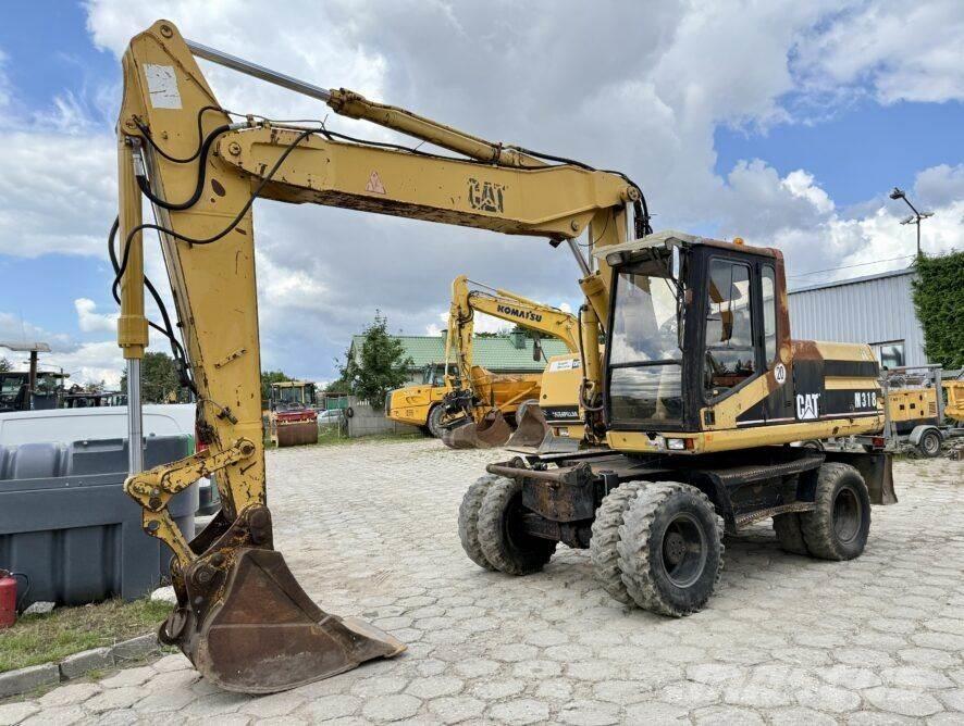 CAT M318 Excavatoare cu roti