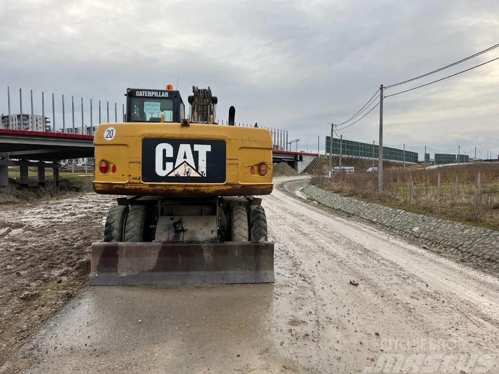 CAT M318D Excavatoare cu roti