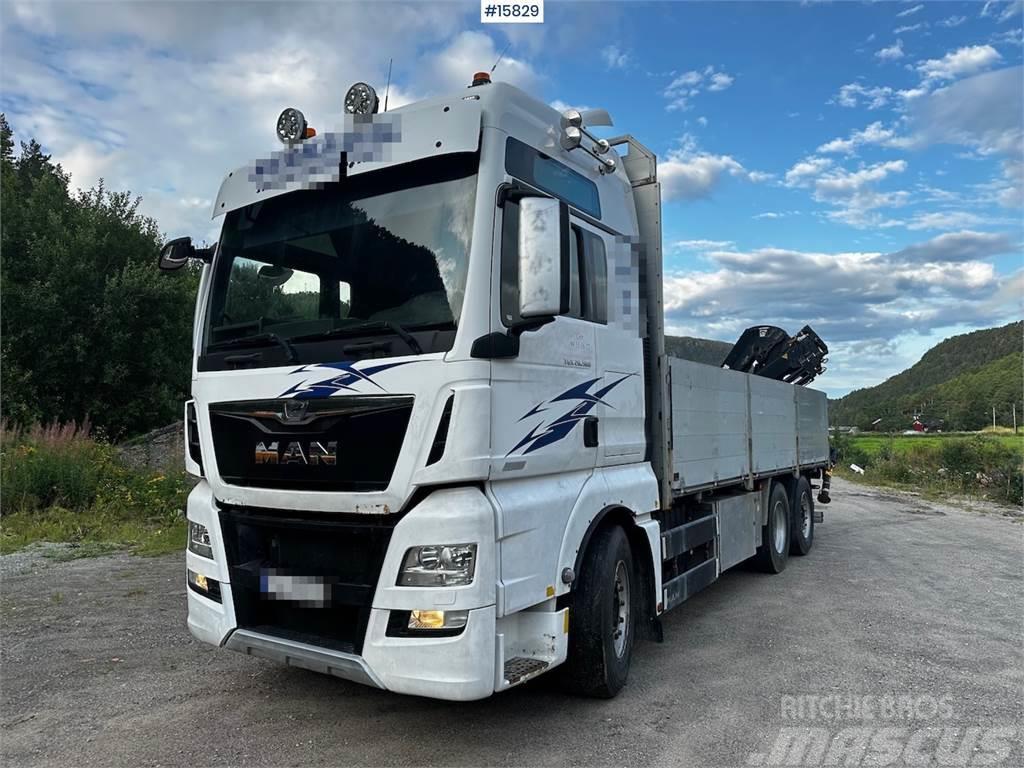 MAN TGX 26.560 Flatbed truck with Hiab 138 crane from  Camioane platforma/prelata