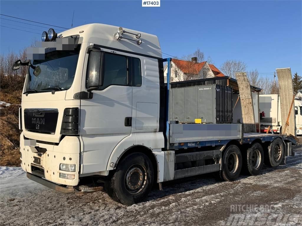 MAN TGX 35.480 8x4 flatbed truck w/ driving bridges Camioane platforma/prelata